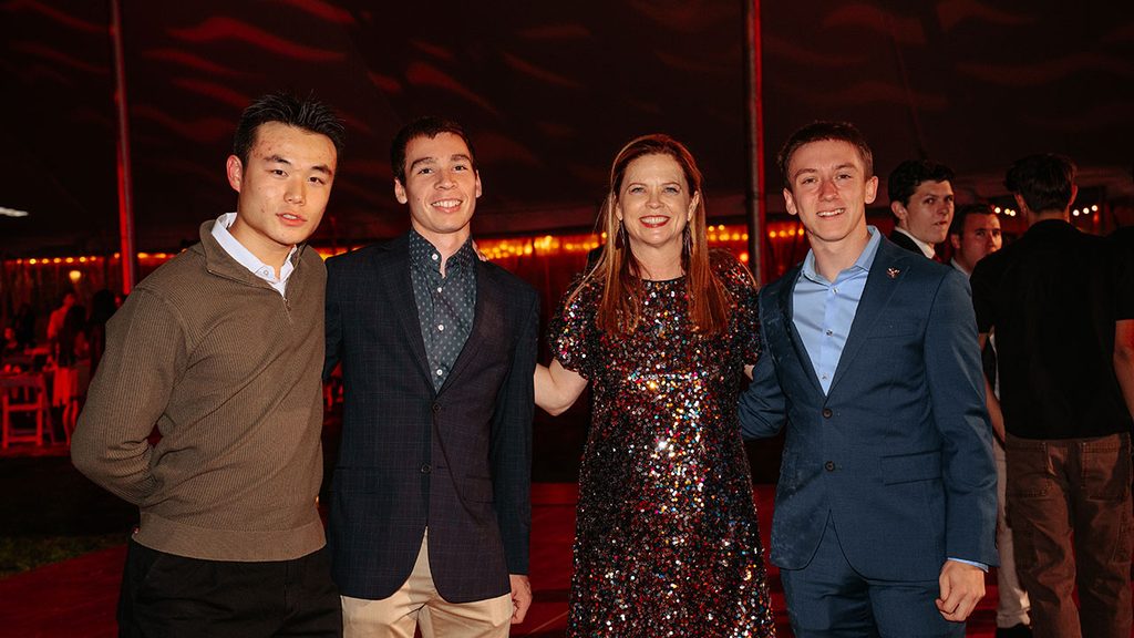 students pose with Tania Tetlow at Fordham President's Ball