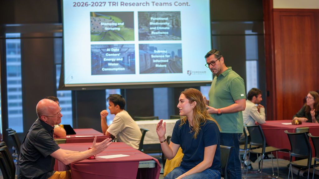 ‘So Much Innovation’: Cross-Disciplinary Research Incubator Launched at Fordham Faculty and students discussing research projects at a Fordham event