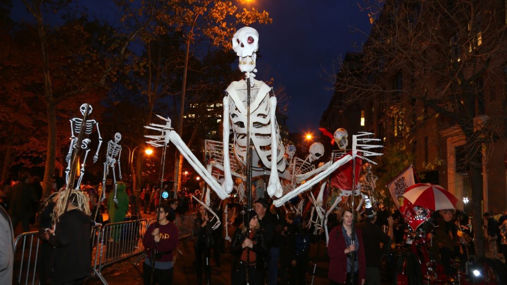 5 Things to Do in NYC | October 2026 A giant skeleton puppet is carried through the streets during the West Village Halloween parade.