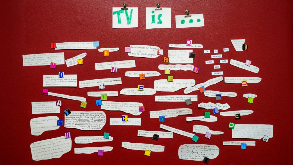 A group of words posted on a wall