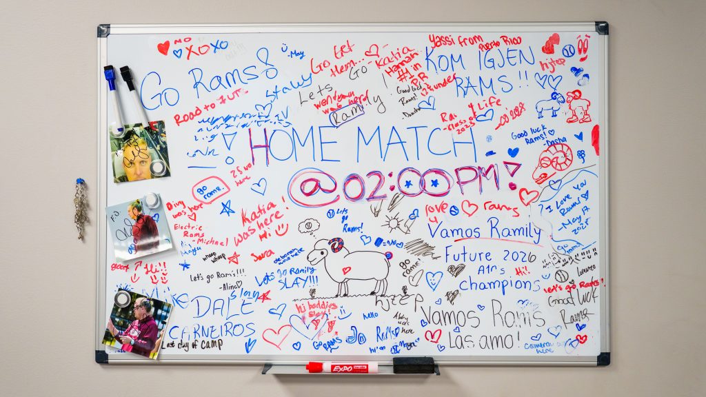 A white dry erase board scrawled with messages